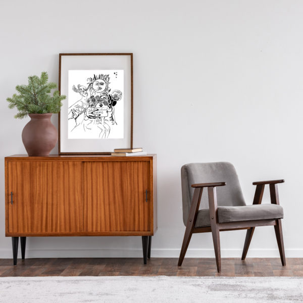 Zdjęcie grafiki „Wenus” zawieszonej na ścianie w salonie.