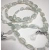 A chain for glasses made of blue glass stones and beige between them.