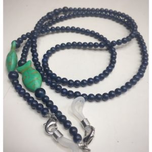 A chain for glasses made of navy blue stones with green fish.