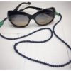Dark blue stones and green fish chain.