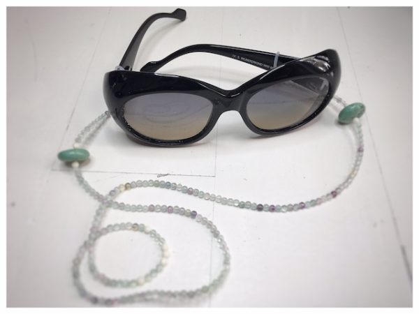 Chain of green and transparent stones.
